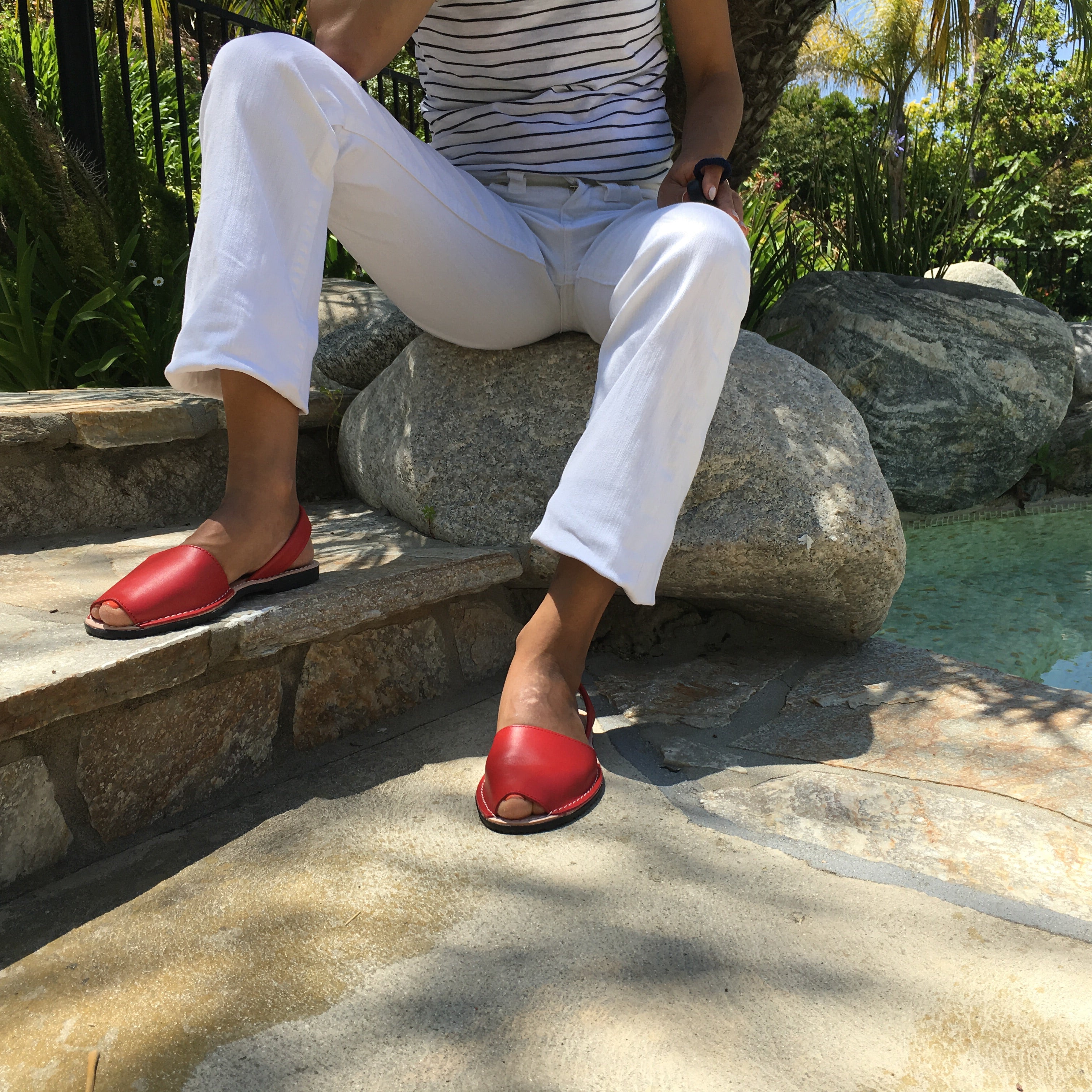 Classic red sandals with white pants  - Instagram