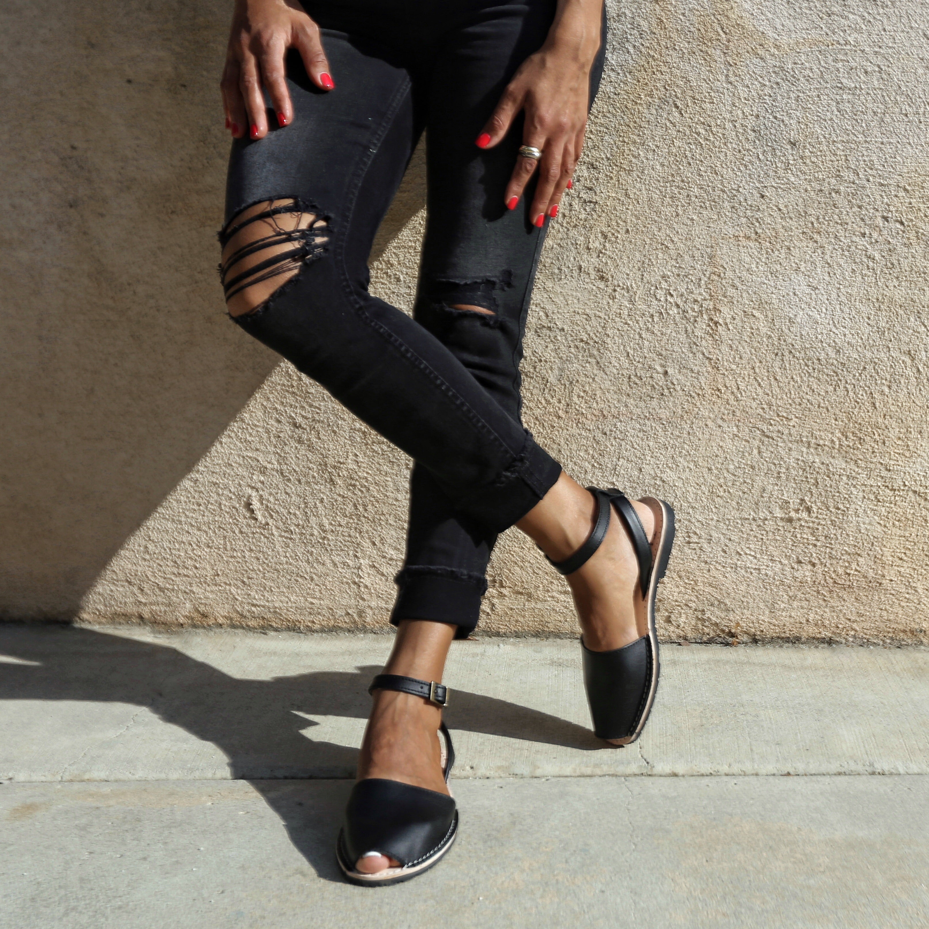 Instagram - black spanish sandals with ankle straps worn with black jeans