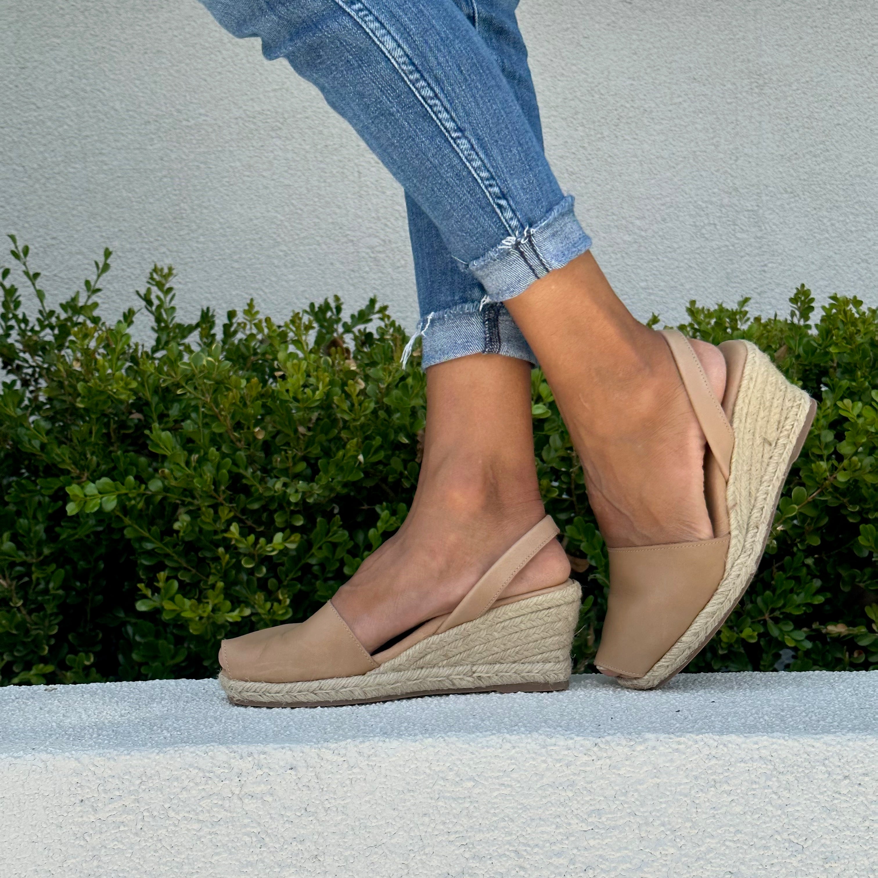 zoom on woman wearing almond espadrille wedges
